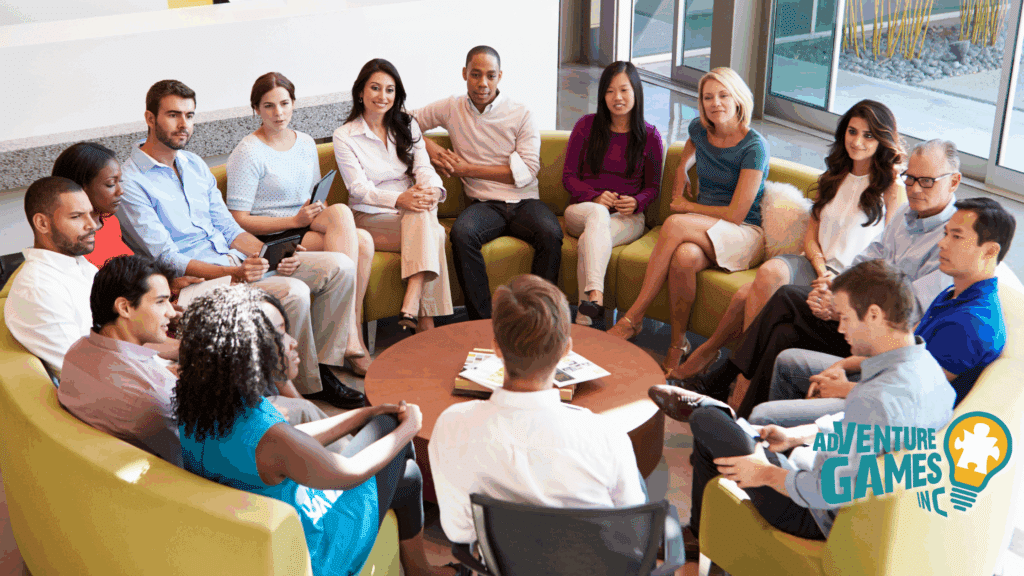 A diverse group of professionals seated in a circle during a team discussion in a modern office lounge, representing collaboration, communication, and teamwork, with the Adventure Games Inc. logo visible in the corner.