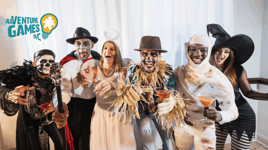 Group of coworkers dressed in Halloween costumes including a skeleton, vampire, angel, scarecrow, mummy, and witch, laughing and holding drinks at an office Halloween party with the Adventure Games Inc. logo.