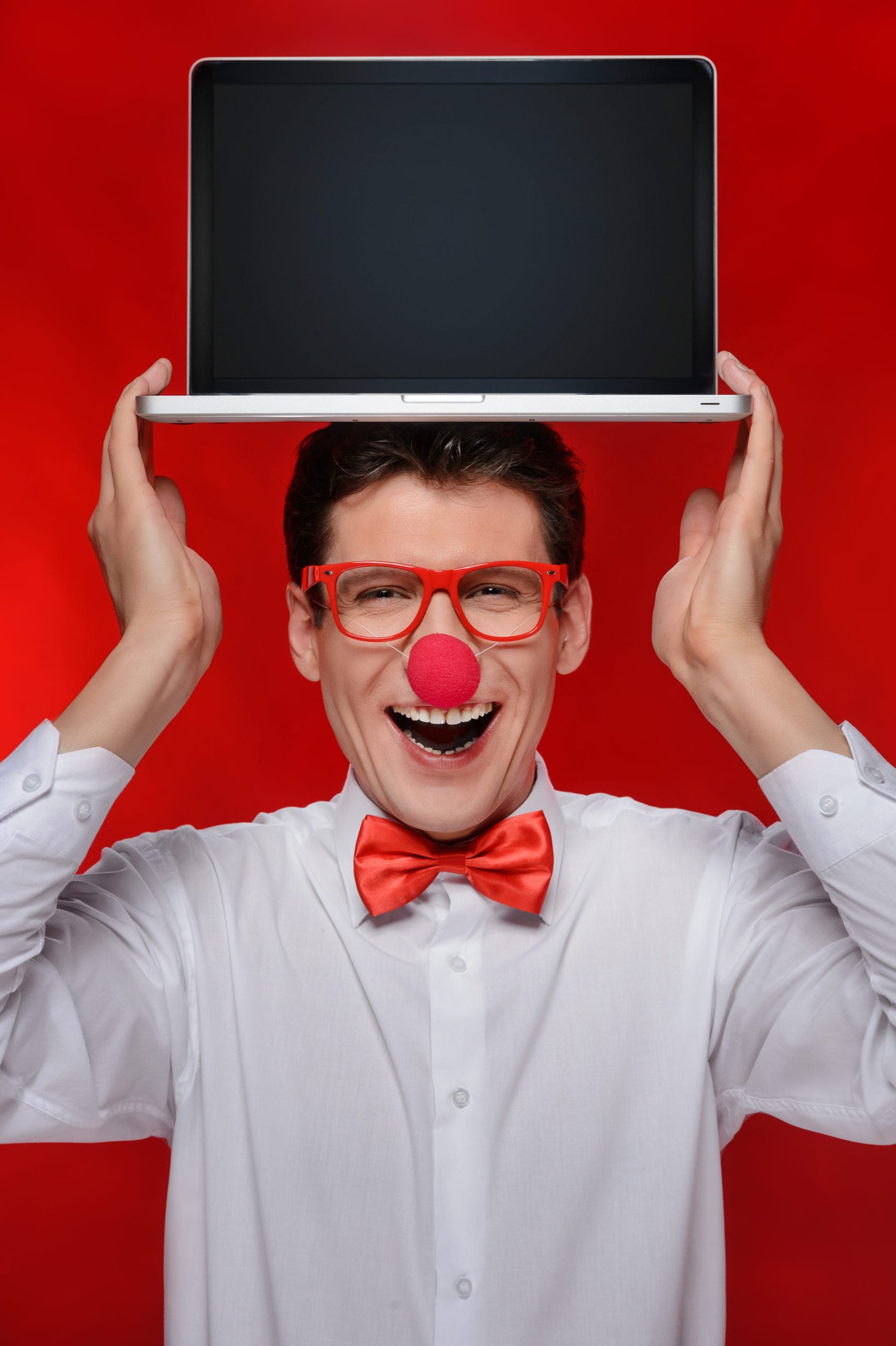 Holding laptop on his head