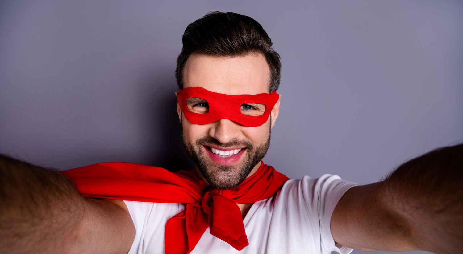 smiling man with eye mask