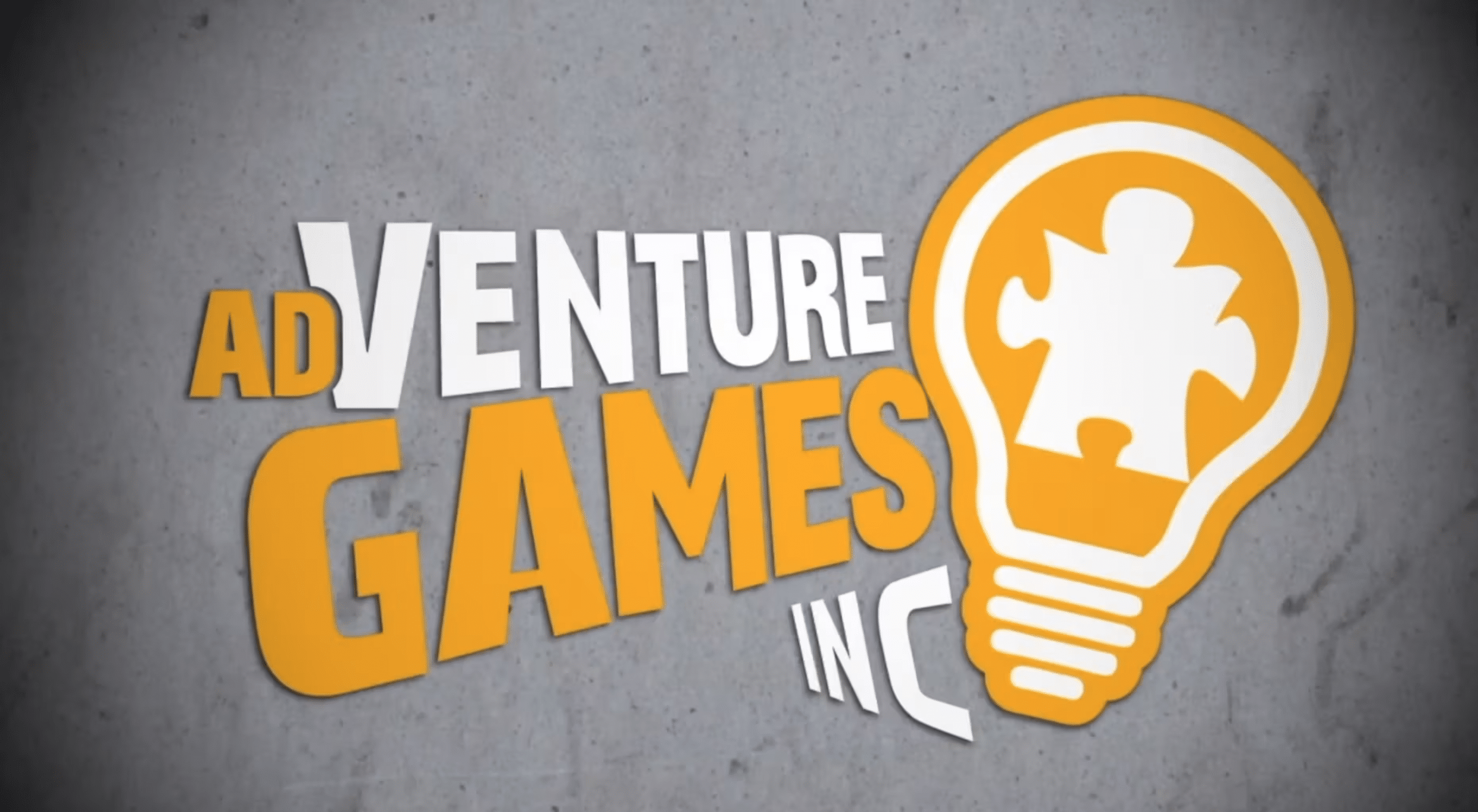 Adventure Games Inc logo on a grey cement background