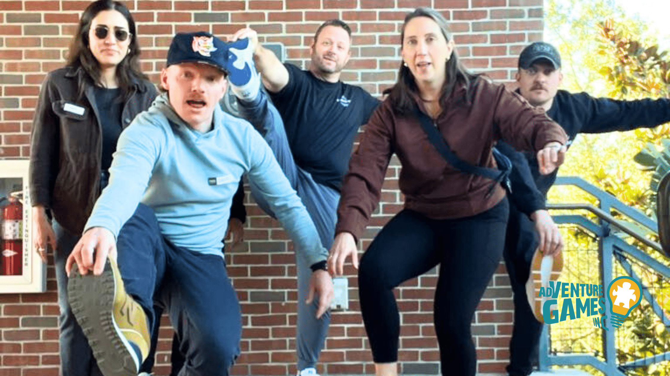 Employees working together during a high-energy team building event by Adventure Games Inc, recognized as the best team building company nationwide