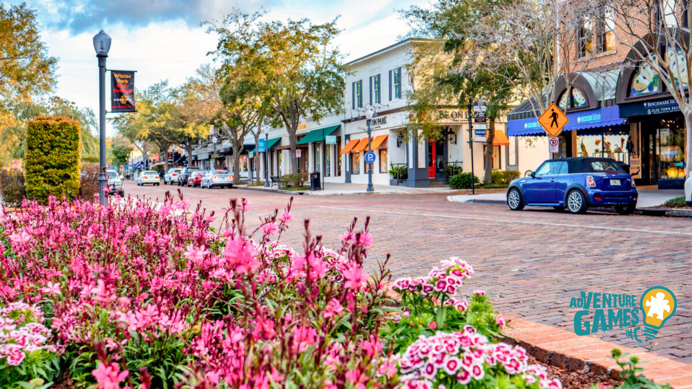 Brick-paved Park Avenue in Winter Park Florida lined with boutiques and spring flowers perfect for a walking team building scavenger hunt