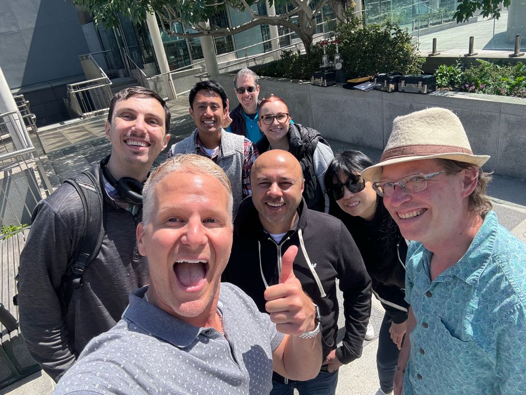 A happy group of coworkers celebrating their Adventure Games Inc. experience in the Bay Area, capturing the energy and excitement of team bonding.