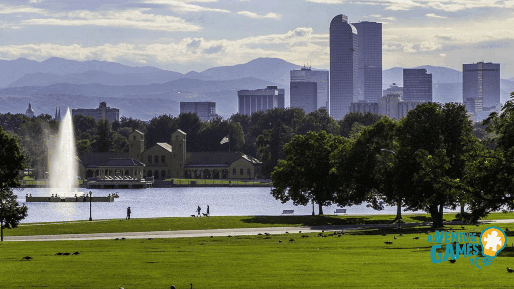 Best Team Building Denver CO by Adventure Games Inc at City Park, Ferril Lake pavilion and fountain with downtown skyline and Rocky Mountains