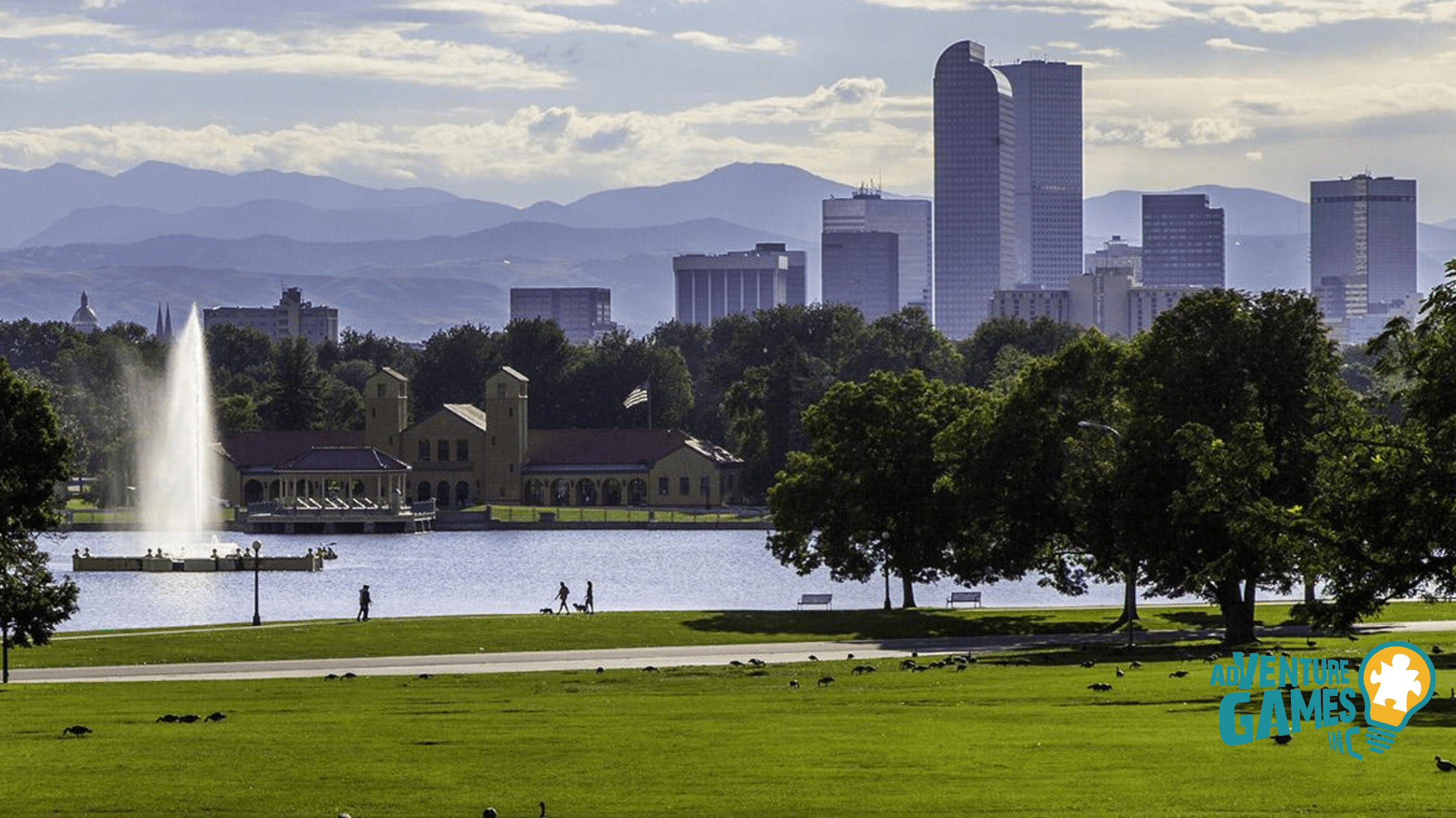 Best Team Building Denver CO by Adventure Games Inc at City Park, Ferril Lake pavilion and fountain with downtown skyline and Rocky Mountains