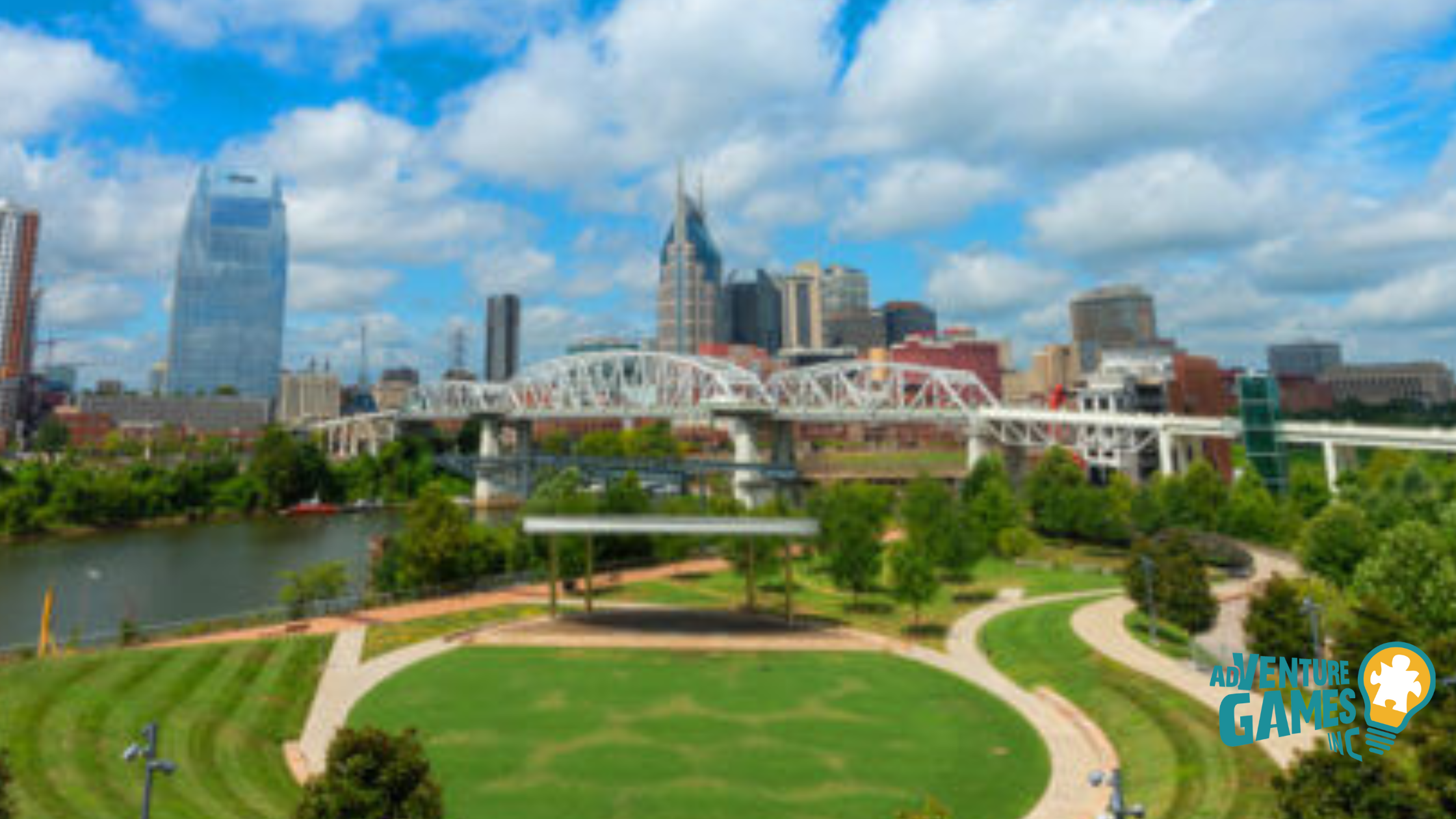 Cumberland Park lawn with the John Seigenthaler Pedestrian Bridge and downtown Nashville skyline.