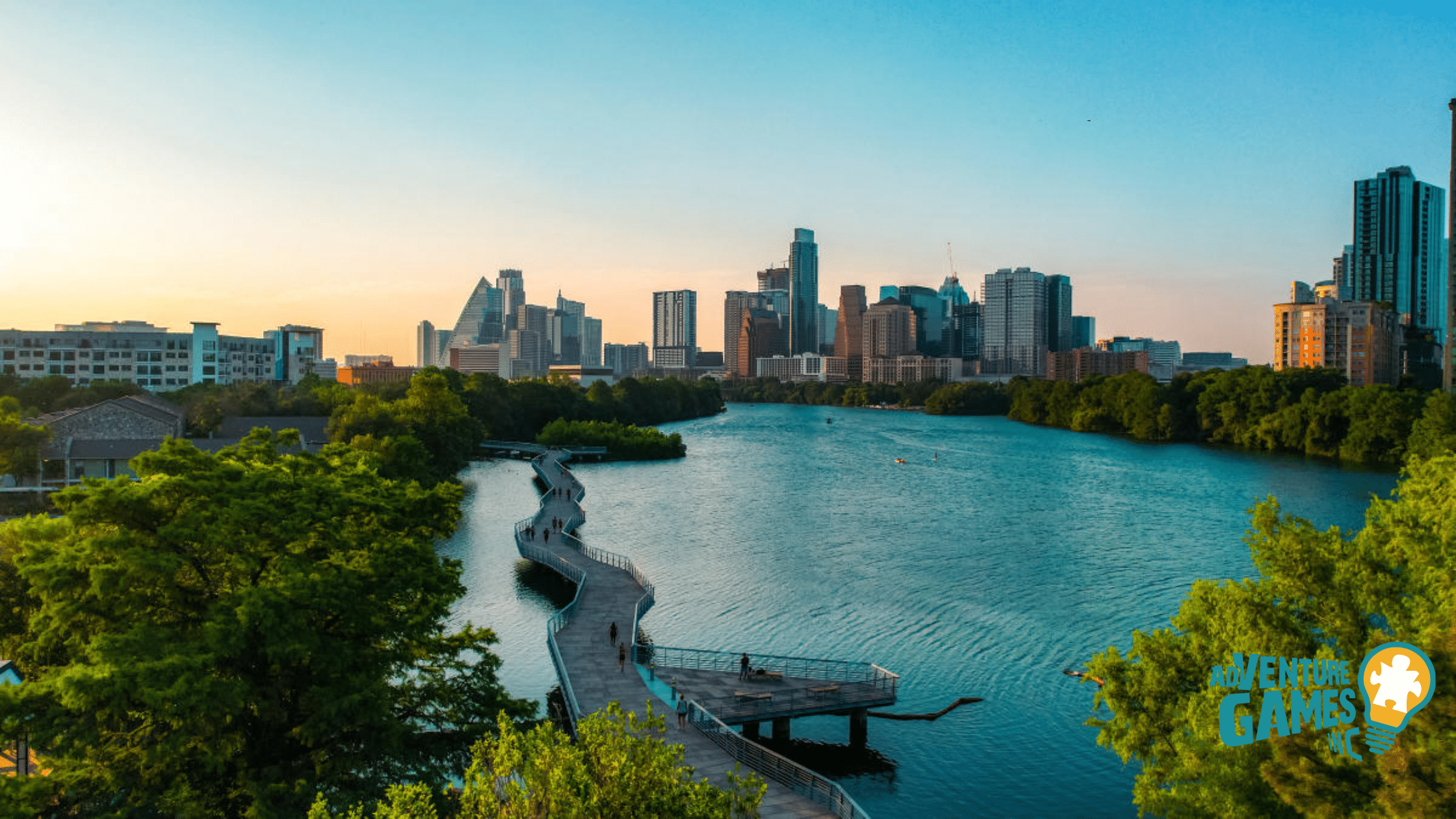 Lady Bird Lake Boardwalk with downtown Austin skyline at sunset, scenic riverside path perfect for team building activities in Austin TX