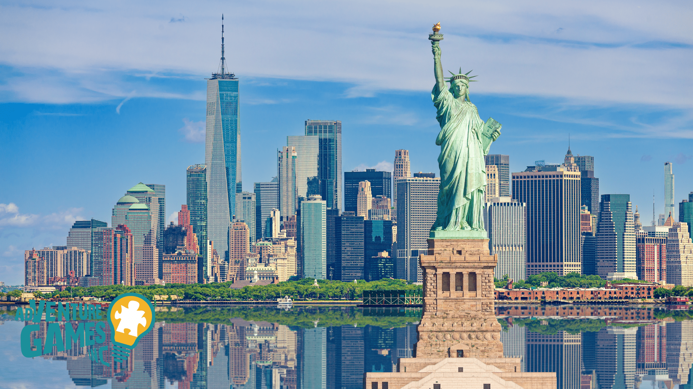 Wide shot of the Statue of Liberty with the Hudson River and the New York City Skyline in the background.