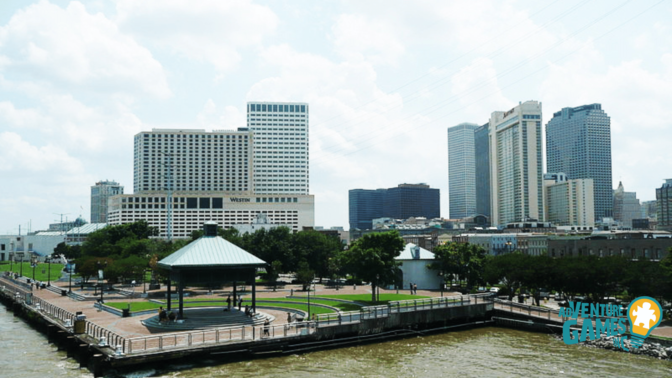Woldenberg Park on the Mississippi River by the French Quarter, with a gazebo, riverwalk and lawns that work well for downtown team gatherings.