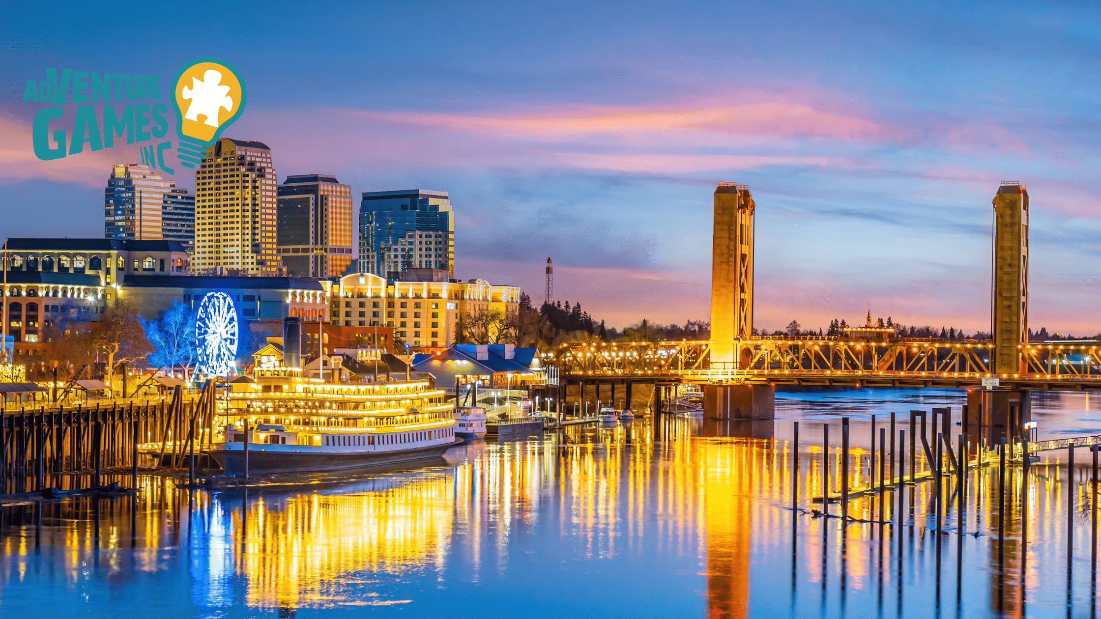 A view of Sacramento city and bridge lights reflecting off of the American River's surface at sunrise