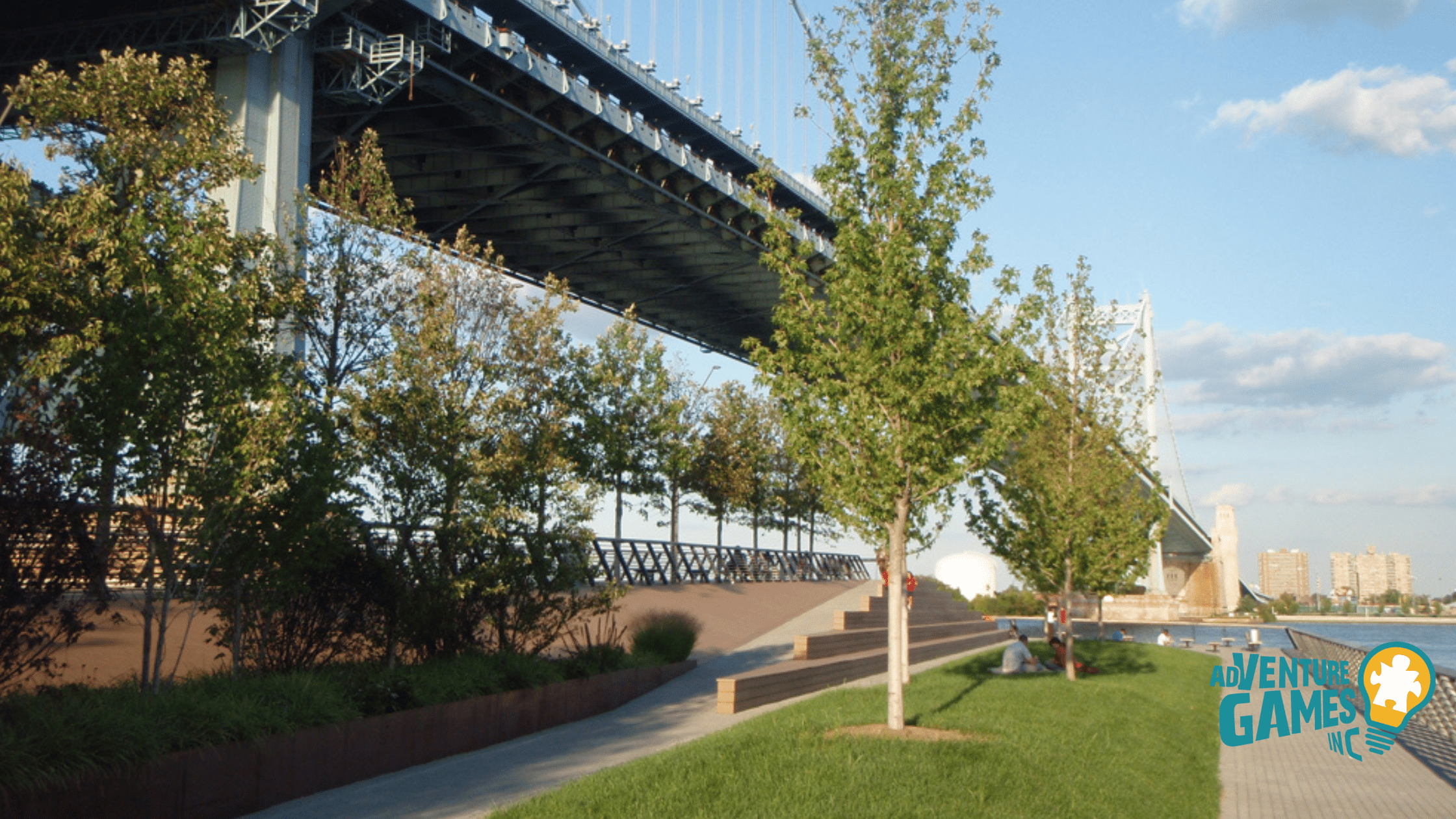 ree-lined Race Street Pier beneath the Ben Franklin Bridge along the Delaware River—waterfront space for team activities.