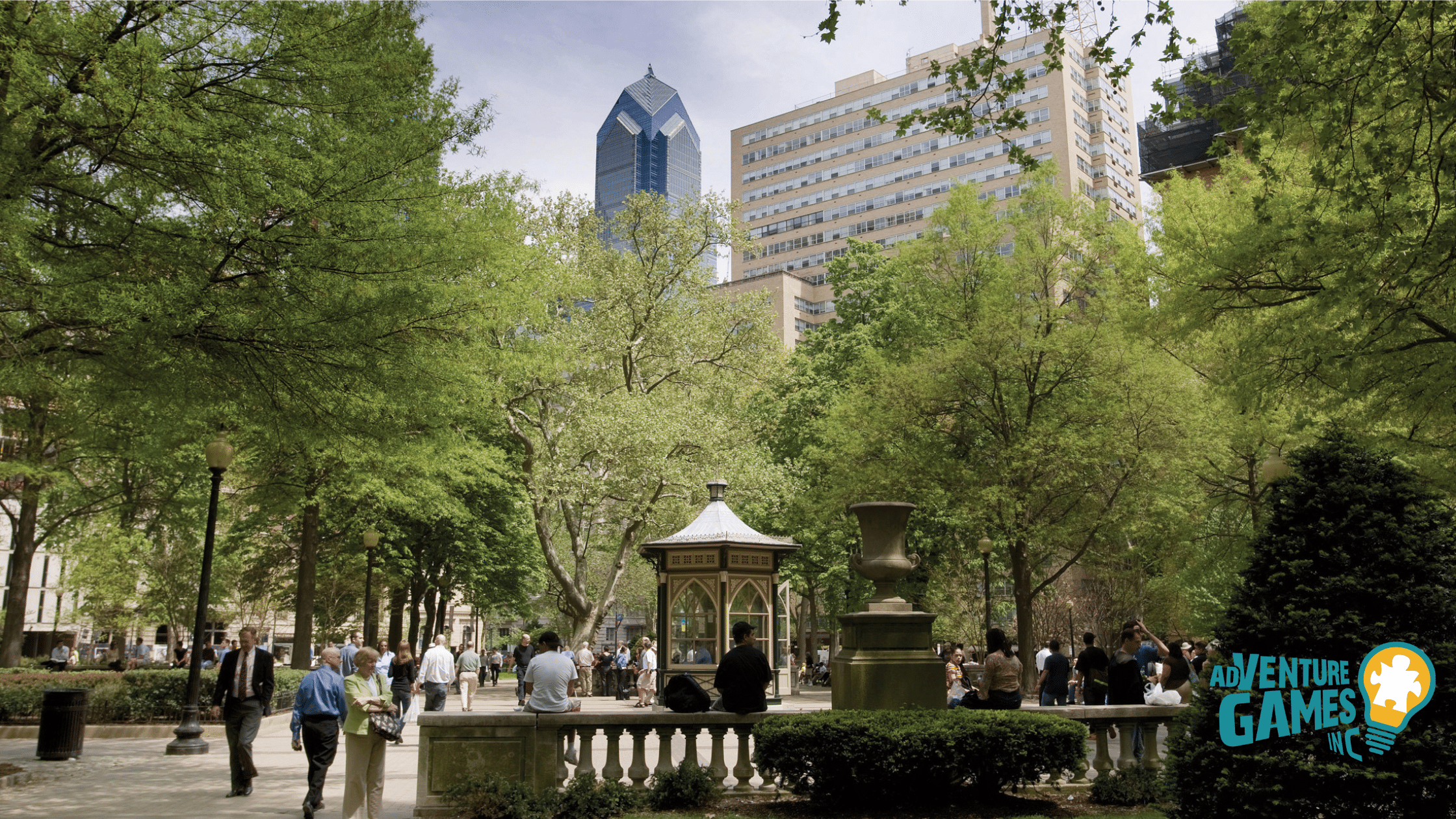 Leafy Rittenhouse Square with historic gazebo and office towers—shaded urban park ideal for group meetups.