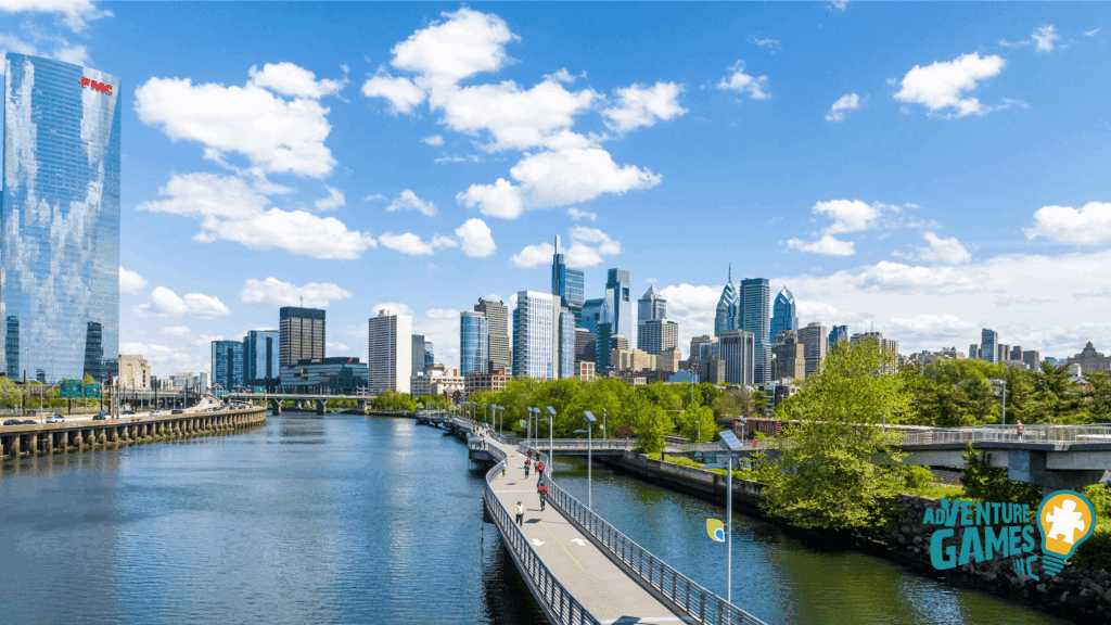 Curving Schuylkill Banks Boardwalk over the river with Philadelphia skyline—scenic path for walks and team challenges.